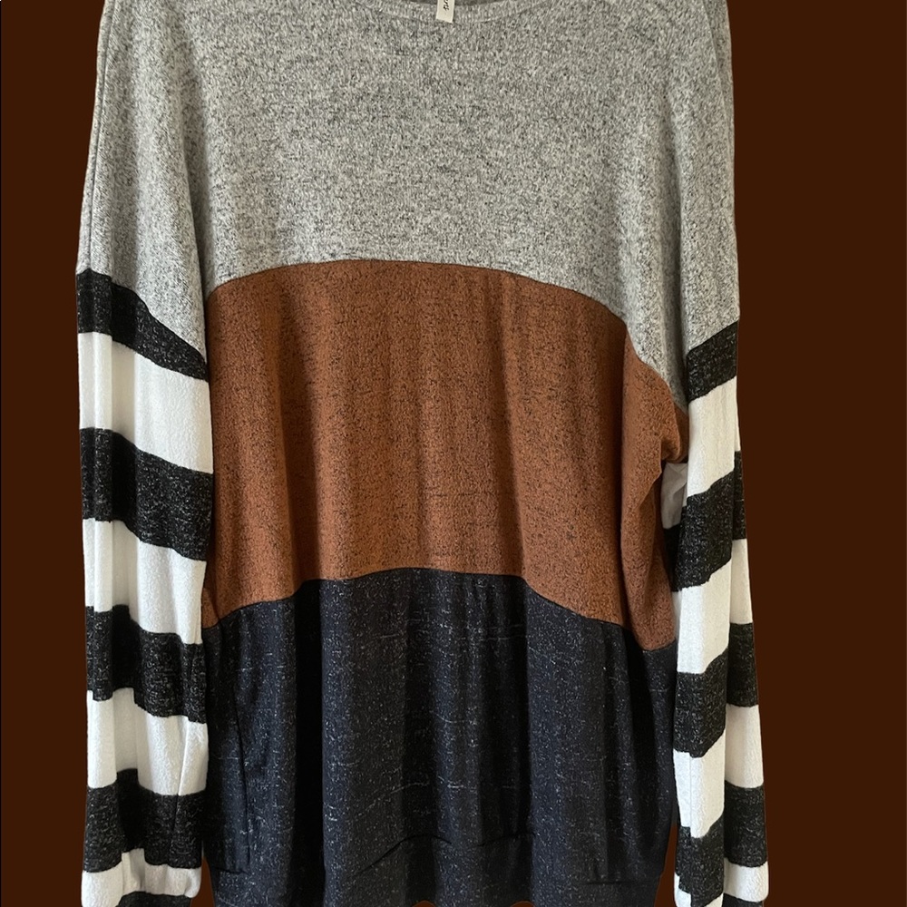 Multi colored (grey,brown,black arms cream and black stripe) tunic.
